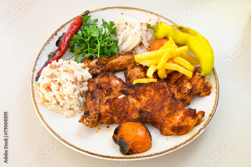 Famous Urfa meat liver, ciger wrapped by lavash with roasted chili pepper, onion and sauce in Sanliurfa, Turkey. Kuzu et ciger sis. Izgara dana bonfile, cop sis, kuzu pirzola. Karisik kebap, beyti keb photo