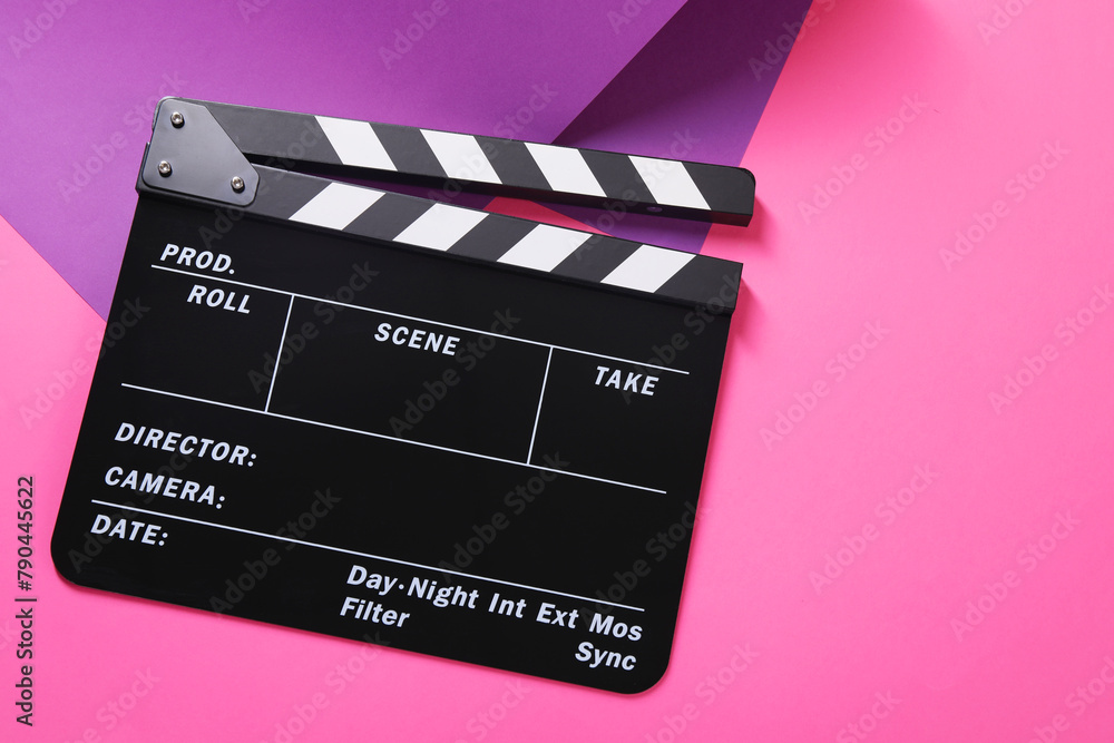 Clapperboard on color background, top view. Space for text