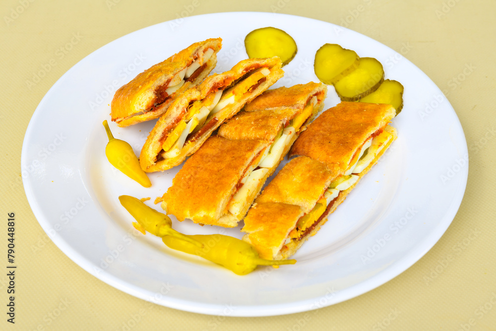 Turkish karisik atom tost ( kasarli bazlama tost) . Sucuklu, Kasarli, kavurmali karisik tost. Flat baked bread toasted Turkish karisik atom tost ( kasarli bazlama tost) . Sucuklu, Kasarli, kavurmali karisik tost. Flat baked bread toasted