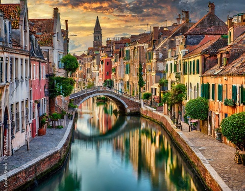 Top view, A network of narrow canals winding through a historic city, lined with colorful buildings and crossed by arched stone bridges. photo