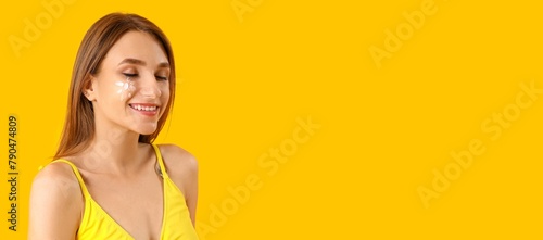 Young woman with sunscreen ...