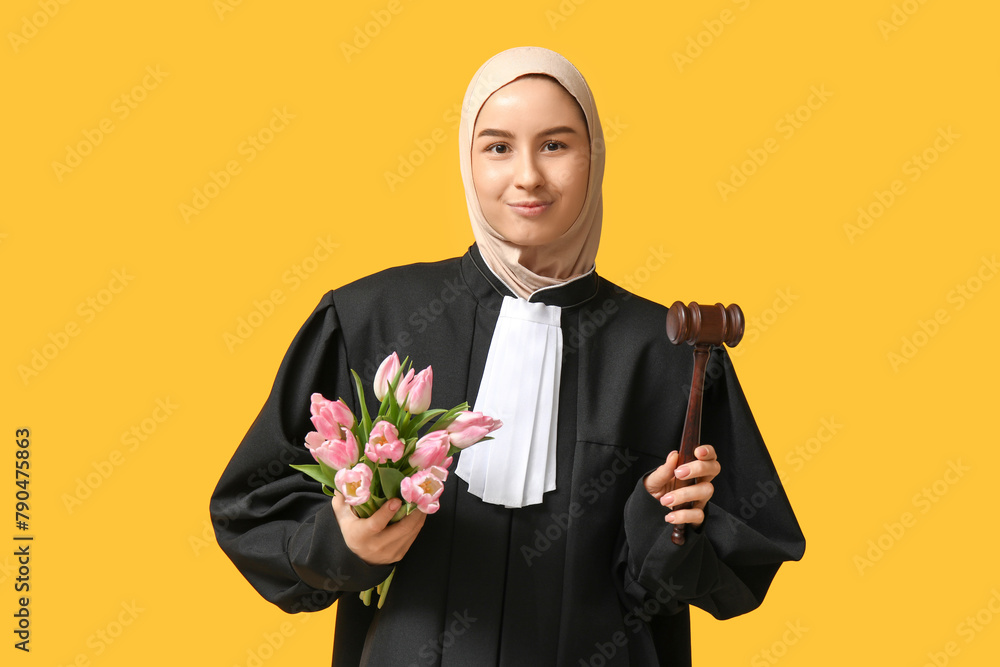 Muslim female judge with pink tulips on yellow background. Women's Day celebration Muslim female judge with pink tulips on yellow background. Women's Day celebration