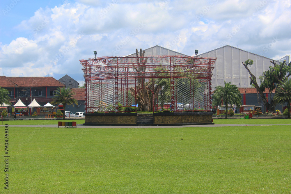 Blitar, Indonesia, April 04, 2024: green square of Blitar city, East Java, Indonesia. The banyan tree icon in the middle of the square. Blitar, Indonesia, April 04, 2024: green square of Blitar city, East Java, Indonesia. The banyan tree icon in the middle of the square.
