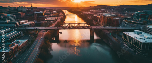 An aerial view at dusk bridges two cities over a river, merging urban landscapes with tranquil waters 🌉🌆 Embrace the serenity of cityscapes at sunset. #790481075