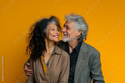 Horizontal shot of mixed race, couple stand closely to each other, isolated over background 