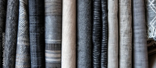 Different types of colorful and textured fabrics displayed on a metal rack, showcasing a diverse selection for sewing or crafting projects