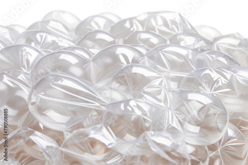 A pile of empty clear bubble wrap evokes a sense of protection and packaging, with its translucent, cushioned texture