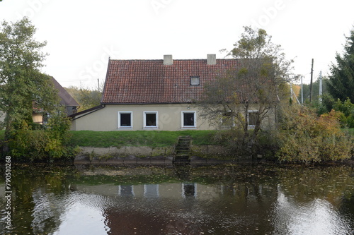 House on the bank of the Polessky Canal in the Kaliningrad region