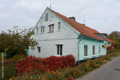 House on the bank of the Polessky Canal in the village of Belomorskoye, Kaliningrad region
