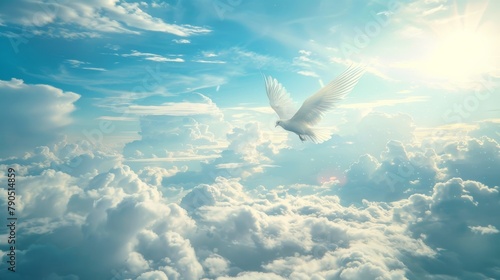 A white dove flies in a bright blue sky. photo