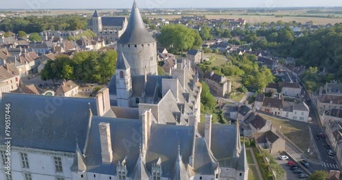 Aerial: An Imposing French Ch�teau Stands Resolute, Its Age-Old Structure And Conical Towers Overseeing The Quiet Town, As Seen From This Bird'S-Eye Perspective. - Chateaudun, France photo