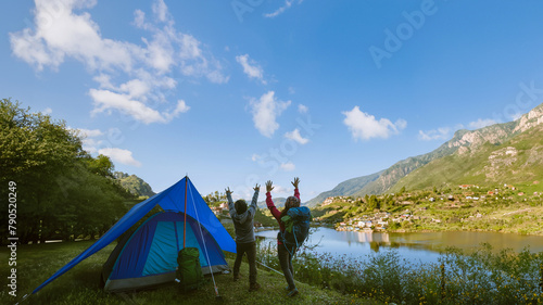Asian couple Mountain camps in rural villages, close to the lake, travel ideas, camping, relaxing holidays.in Thailand