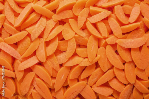 Fresh raw peeled carrot slices. Food background