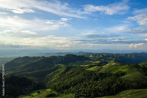 Beautiful sunlight and blue sky with cloud over the mountain of Thailand.