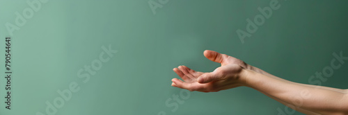 Gentle hands web banner. Hands on green background with copy space.