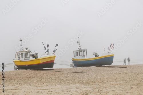 Beach in the fog  fishing boats in the foreground. Baltic Sea  Sopot  Poland 