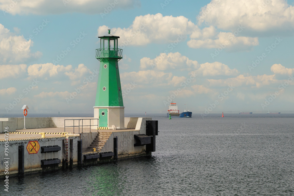 Obraz premium The Bay of Gdansk, the Baltic Sea. Entrance to the port of Gdansk, two lanterns indicating the waterway for ships 