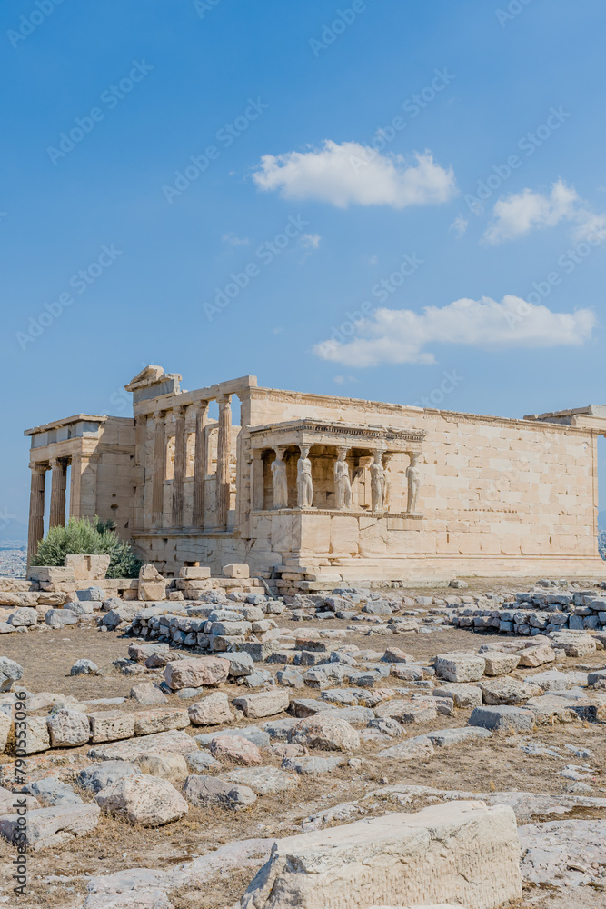 Obraz premium The Erechtheion temple with its iconic columns stands majestically atop the Acropolis in Athens Greece