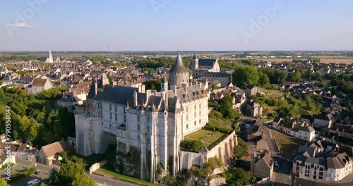 Aerial: Majestic Ch�teau With Classic French Architecture Looms Over A Serene Township, With A River Elegantly Curving Around The Town'S Edge. - Chateaudun, France photo