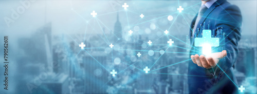 Businessman holding health IT icon, networking and enhancing healthcare efficiency, digital connection, improving patient care, healthcare service, innovative technology, and interconnected network.