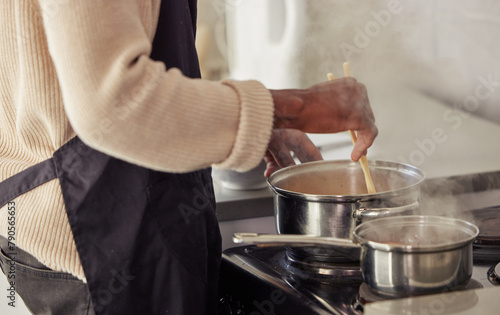 Hands, cooking and pot with steam in the home for lunch or dinner, busy and hungry for food with preparation. Catering, Person with chopsticks for Asian cuisine and meal with nutrition in kitchen