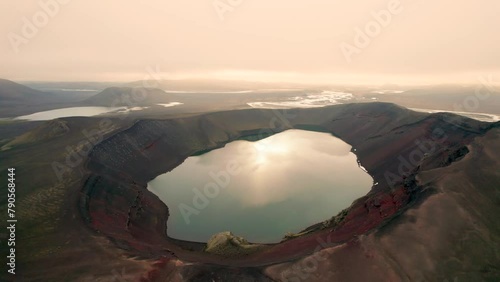 Aerial View of Iceland Ljotipollur Crater Water Filled Caldera at Sunset. Drone Circles Around Epic Wide Volcano Explosion Crater. 4K High Quality Color Corrected. photo