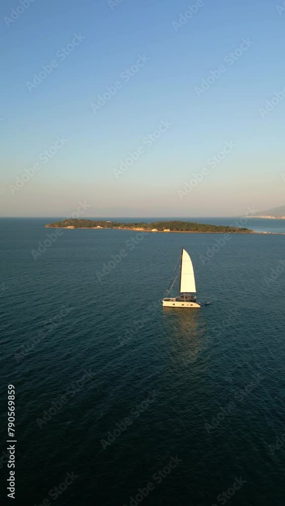 Sailing catamaran in the Aegean Sea in urla izmir Turkey. High quality 4k footage Sailing catamaran in the Aegean Sea in urla izmir Turkey. High quality 4k footage