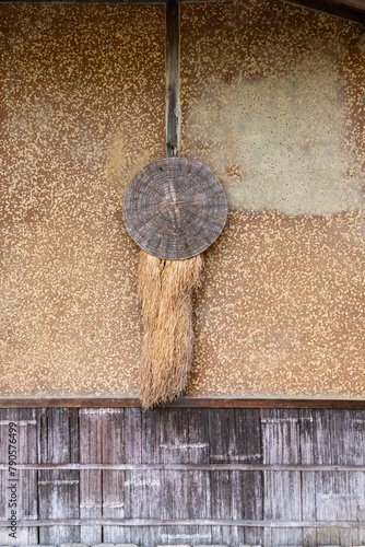 Obraz na płótnie Sedge hat and straw rain cape used in 17th century in Japan, decorated at Rakushisha in Kyoto w salonie