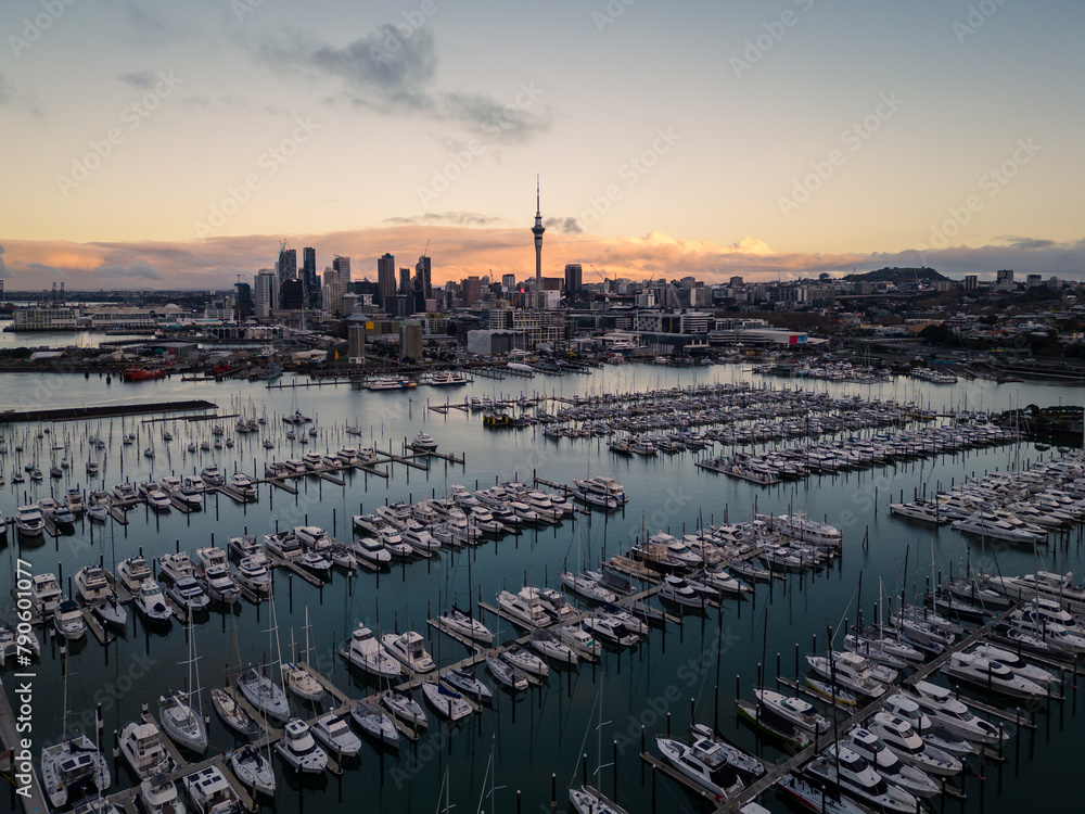 Auckland, New Zealand: Aerial of the Auckland downtown district skyline with the Westhaven Marina at sunset in New Zealand largest city.