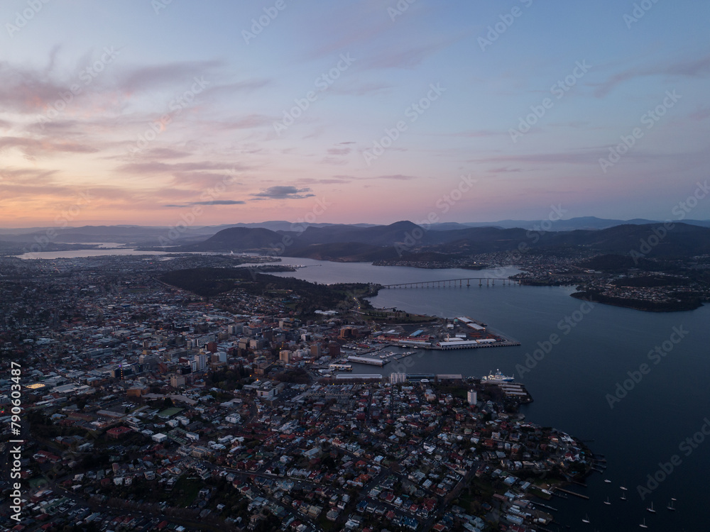 Hobart, Australia: Aerial drone view of a dramatic sunset over the Hobart city in Tasmania main city in Australia.