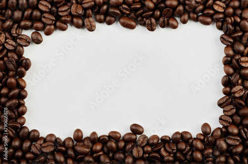 Coffee beans border frame isolated on white background. Top view coffee beans with copy space for text in the middle of image. Coffee beans frame banner