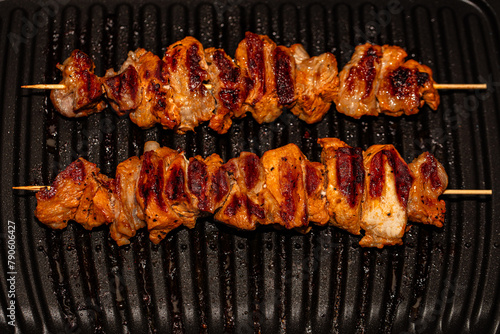 Closeup of meat prepared on electric grill © Ruslan