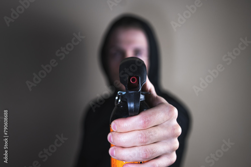 Man with pepper spray in his hands