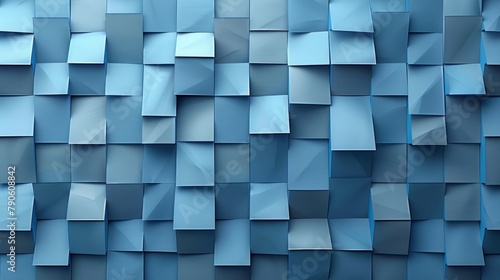   A tight shot of a blue wall, composed of blocks with diverse shades, heights, and widths photo