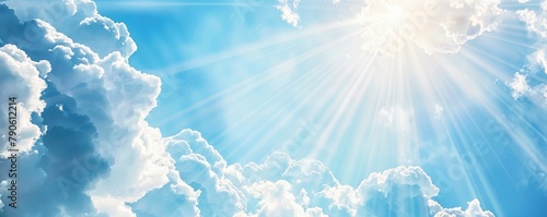 white clouds floating in a blue sky with banners of sunlight
