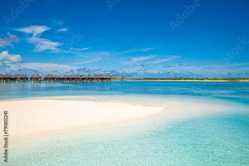 Maldives water villas paradise background. Tropical landscape, seascape with long pier, water villas, amazing sea sky and lagoon beach, tropical nature. Exotic tourism destination, summer vacation