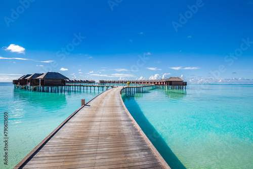 Maldives water villas paradise background. Tropical landscape, seascape with long pier, water villas, amazing sea sky and lagoon beach, tropical nature. Exotic tourism destination, summer vacation