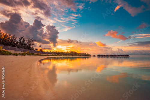 Island palm tree sea sand beach. Amazing beach landscape. Inspire tropical seascape horizon. Orange golden sunset sky calm reflection tranquil relax summer paradise. Vacation travel tourism beachfront