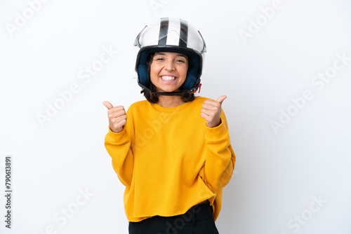 Woman with a motorcycle helmet with thumbs up gesture and smiling
