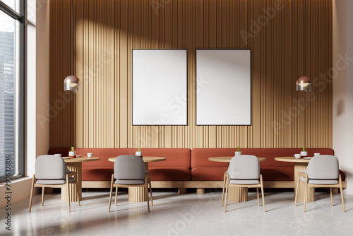 Interior of a modern cafe with blank posters on the wall, wooden design elements, and minimalist furniture, concept of interior design. 3D Rendering © ImageFlow