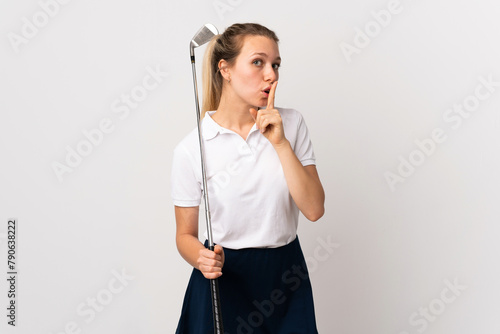 Young golfer woman over isolated white background doing silence gesture photo