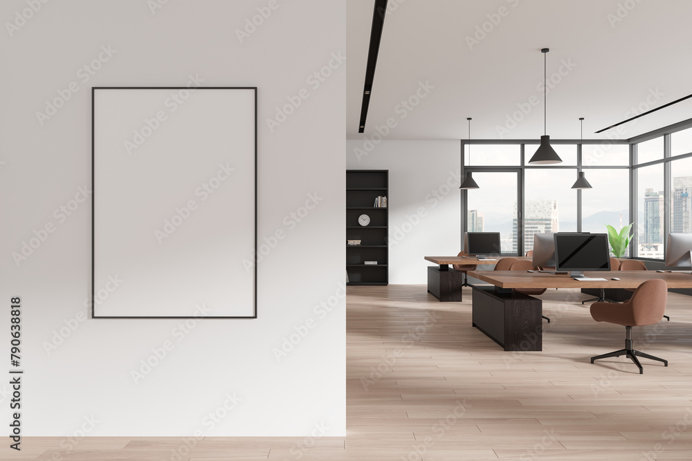 Fototapeta premium Stylish coworking interior with pc monitors on tables, window. Mockup frame