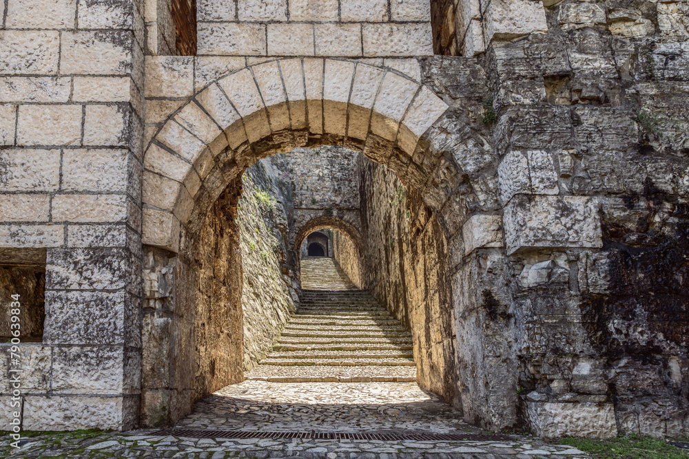 A concealed ascent into Brescia Castle, the northern staircase beckons through historic arches from Strada del Soccorso. Italy