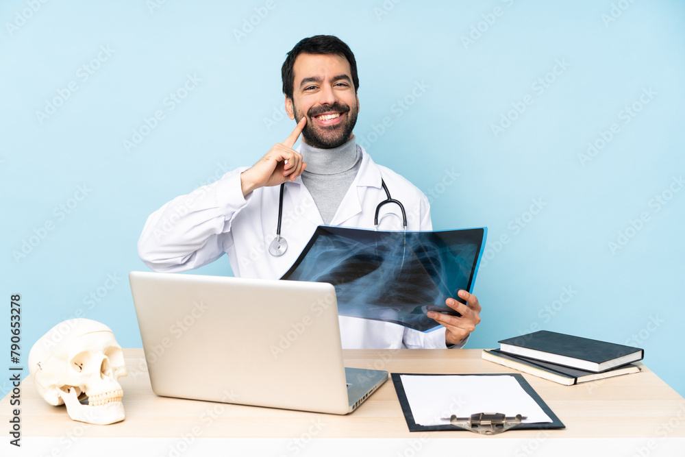 Professional traumatologist in workplace smiling with a happy and pleasant expression Professional traumatologist in workplace smiling with a happy and pleasant expression