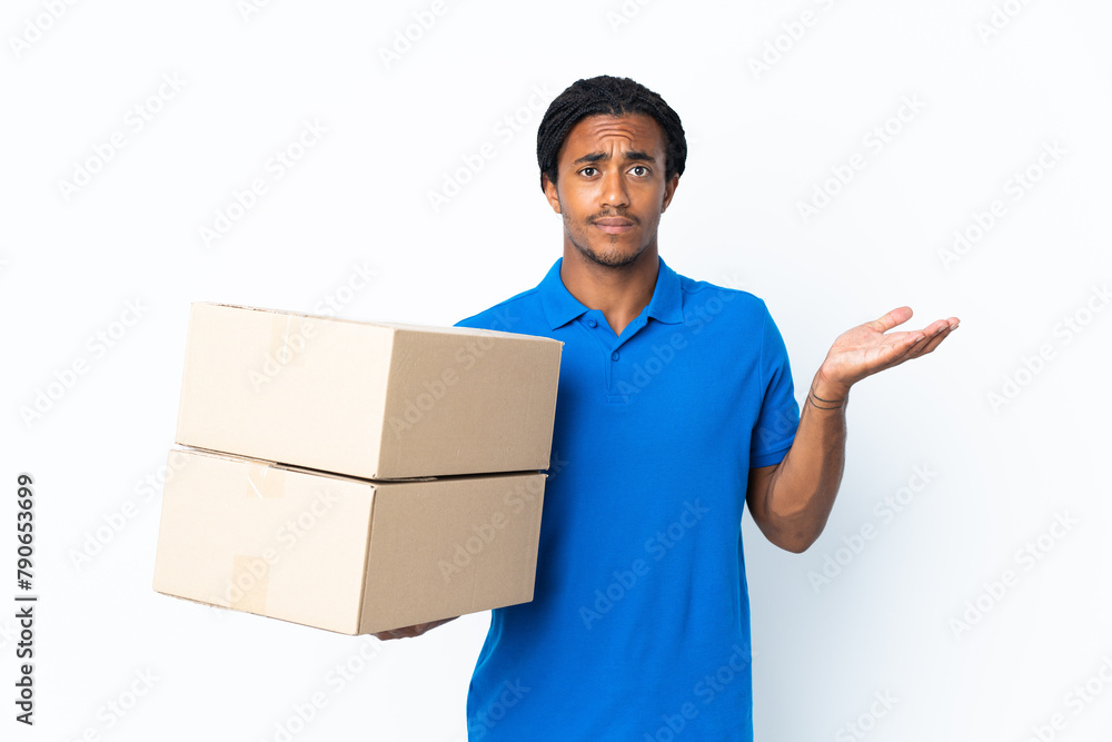 Delivery African American man with braids isolated on white background having doubts while raising hands Delivery African American man with braids isolated on white background having doubts while raising hands