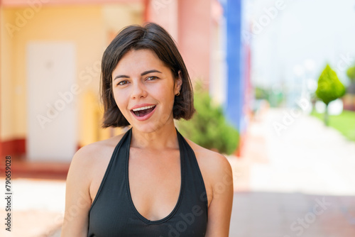 Young pretty Bulgarian woman at outdoors with surprise facial expression Free Download Young pretty Bulgarian woman at outdoors with surprise facial expression - GFXLoad