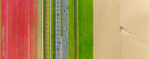 Drone view of a road in the middle of a field. Landscape from a drone. Road and transport. Agricultural transport. Tractor in the field. View from above. Agriculture and growing plants.