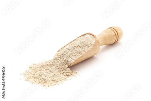 Front view of a wooden scoop filled with Organic Multi-Grain Flour. Isolated on a white background.