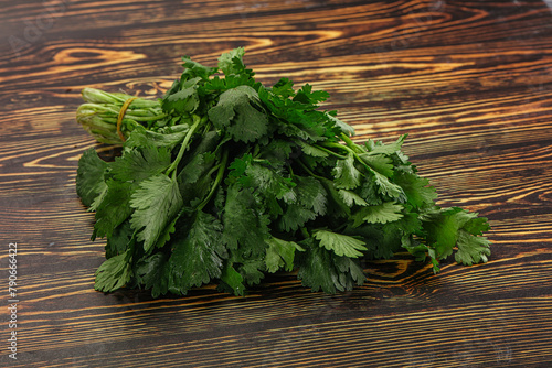 Fresh green cilantro branches heap photo