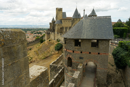 Carcassone castle with ramparts and towers on sunny day, popular tourist landmark in France